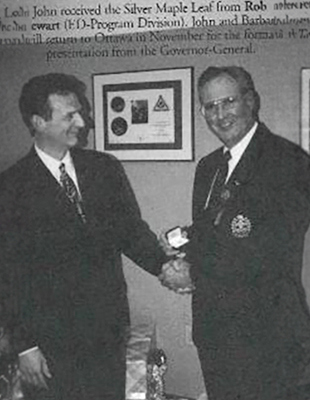Former CEO of Scouts Canada, John Pettifer receiving the Silver Maple Leaf